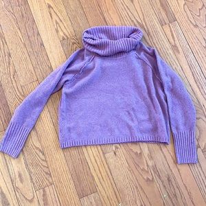 Pink cropped sweater.